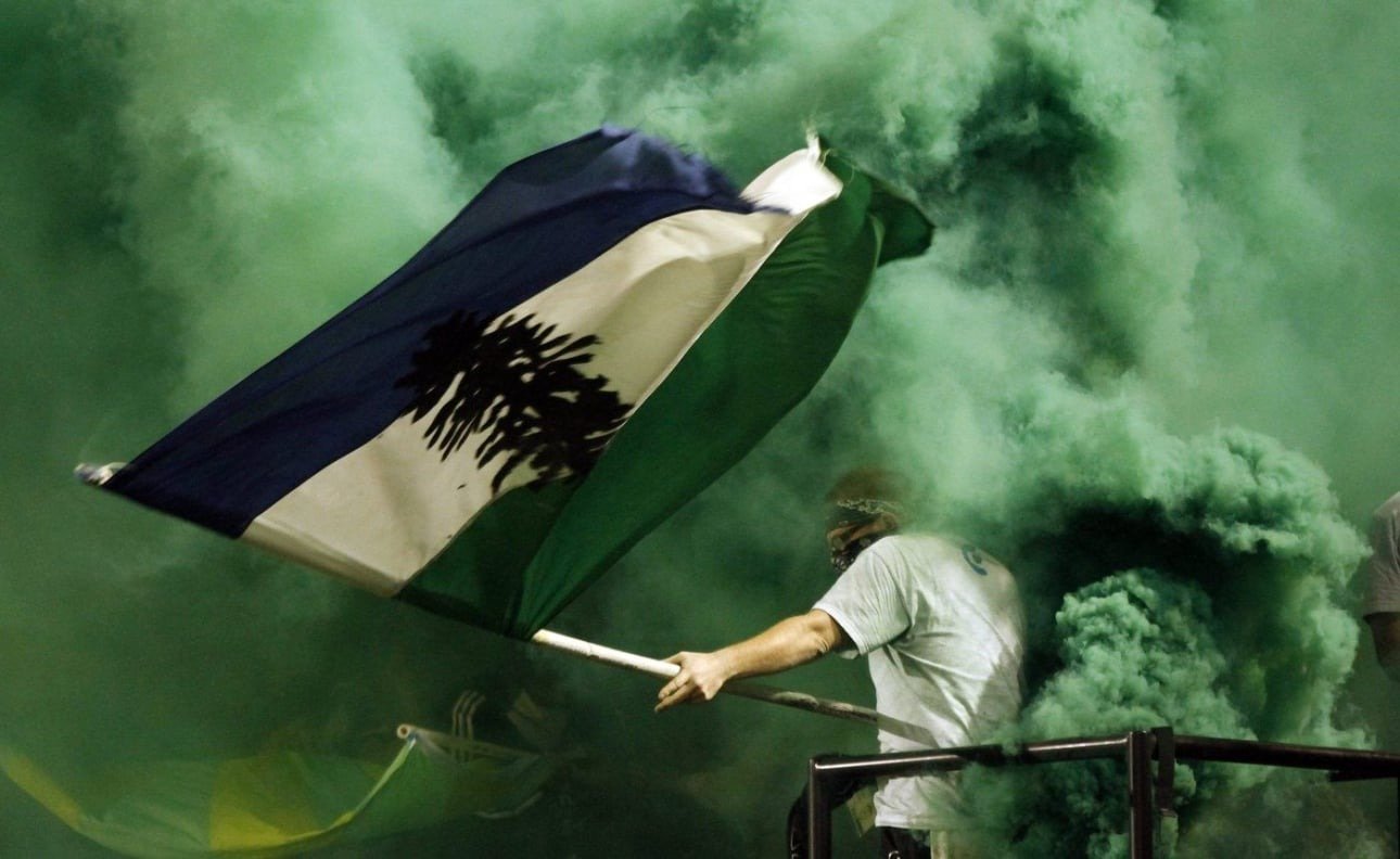  A Portland Timbers fan waves the Cascadia flag as he celebrates a second half goal during their MLS soccer game against the San Jose Earthquake on Tuesday, July 3, 2012, in Portland, Ore. Portland won 2-1. (AP Photo/Don Ryan) 