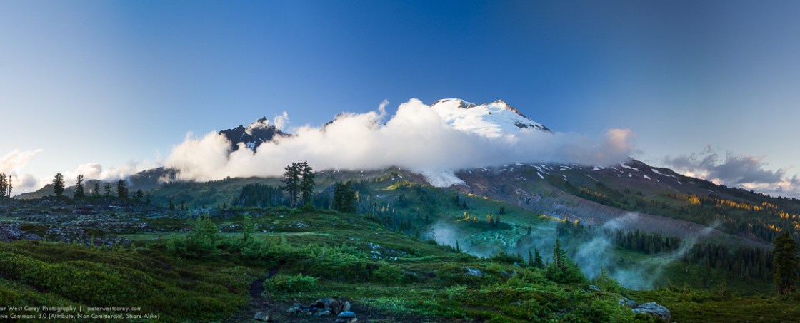 Sunset, clouds and rich forest colors combine to make Mount Baker appear particularity stunning. 