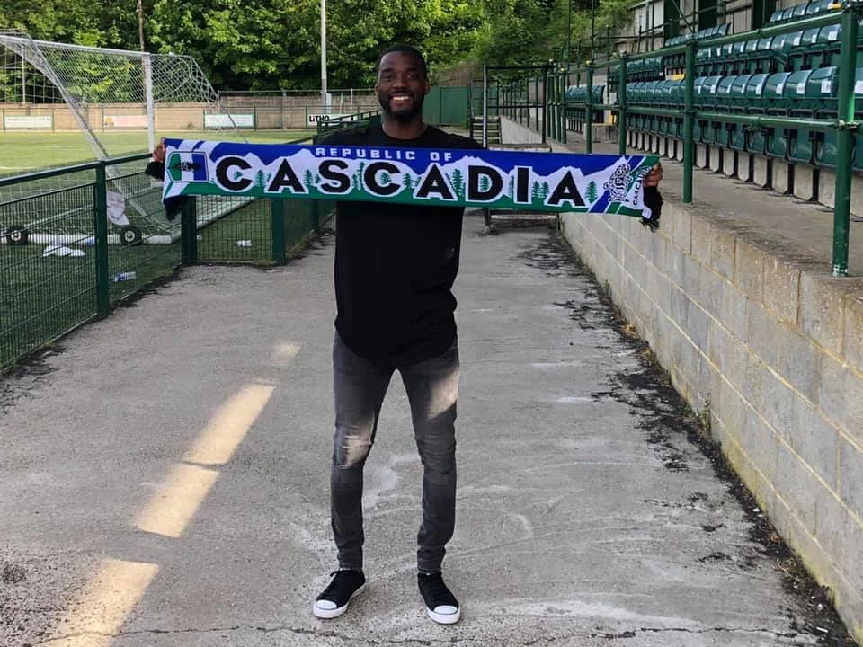 Team Captain Patrick Wilson holding his Republic of Cascadia Scarf. 