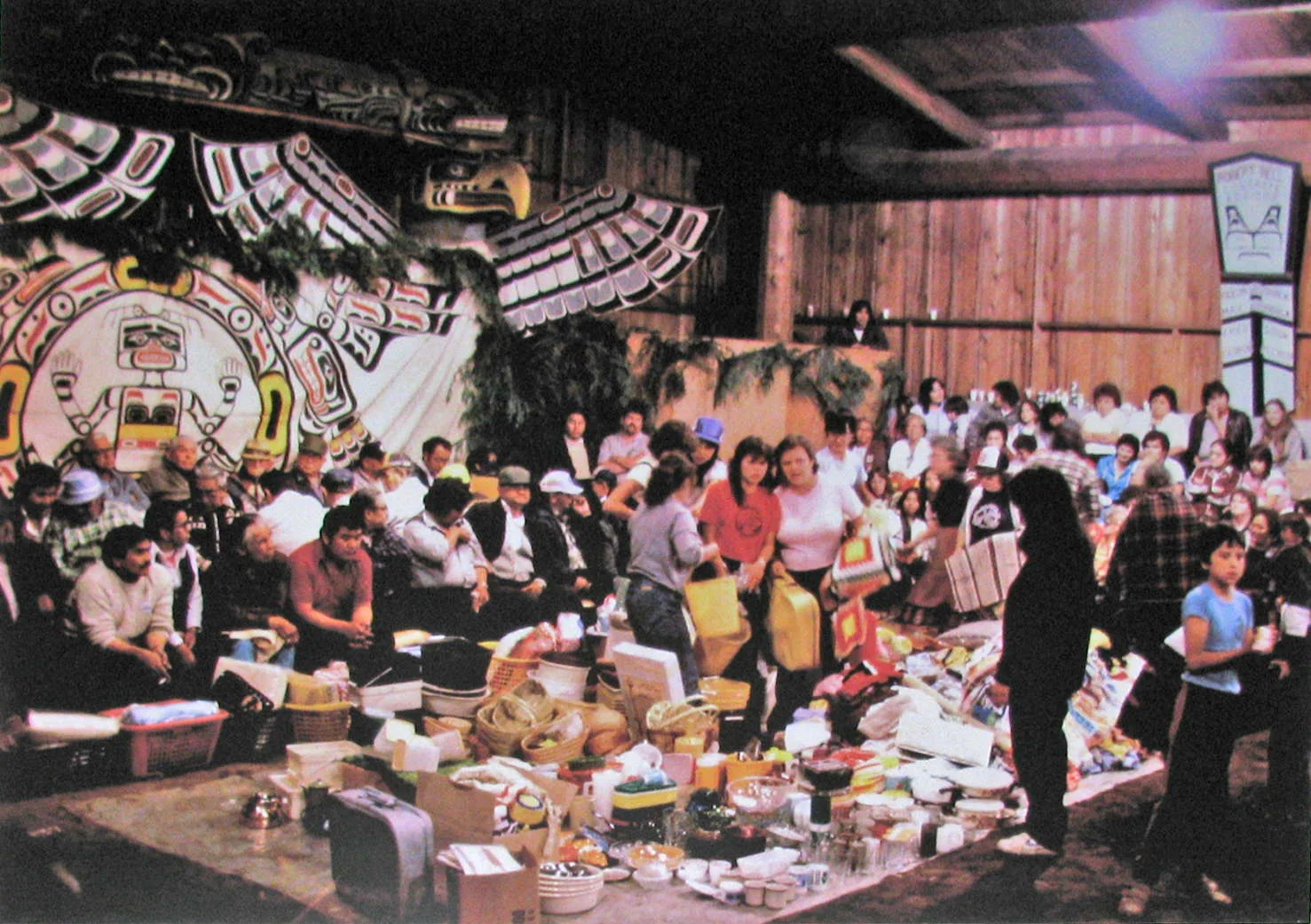  Gifts being distributed to guests at a potlatch given by Tlakwagila (W.T. Cranmer). Alert Bay, 1983. 